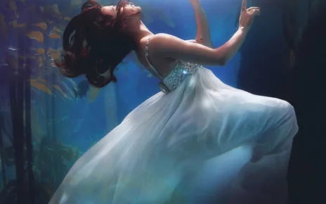underwater photography of woman wearing white dress